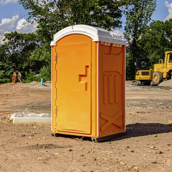 what is the cost difference between standard and deluxe portable restroom rentals in Aneth